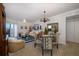 Open living and dining area with coastal decor and chandelier at 4516 Seagull Dr # 413, New Port Richey, FL 34652