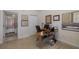 Home office with a desk, chair, and adjacent bathroom at 4516 Seagull Dr # 413, New Port Richey, FL 34652