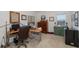 Home office with a desk, chair, and ample storage at 4516 Seagull Dr # 413, New Port Richey, FL 34652