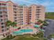 An aerial view of a condo complex featuring a refreshing swimming pool at 4516 Seagull Dr # 413, New Port Richey, FL 34652