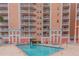Community pool and spa with building view at 4516 Seagull Dr # 413, New Port Richey, FL 34652