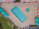 Overhead view of a refreshing community pool and hot tub at 4516 Seagull Dr # 413, New Port Richey, FL 34652