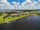 Aerial view of waterfront condo building with private dock at 4550 Bay Blvd # 1237, Port Richey, FL 34668