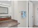 Bathroom with granite countertop, large mirror, and ample storage at 4550 Bay Blvd # 1237, Port Richey, FL 34668