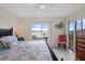 Primary bedroom with water views, king bed, and private access to balcony at 4550 Bay Blvd # 1237, Port Richey, FL 34668