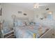 Bedroom with full-size bed, coastal decor and natural light at 4550 Bay Blvd # 1237, Port Richey, FL 34668