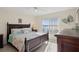 Bright bedroom with water view, king-size bed, and ample natural light at 4550 Bay Blvd # 1237, Port Richey, FL 34668