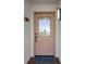 Condo entry with light beige door and stained glass window at 4550 Bay Blvd # 1237, Port Richey, FL 34668