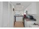 White kitchen cabinets and granite countertops, open to living area at 4550 Bay Blvd # 1237, Port Richey, FL 34668