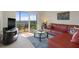 Living room featuring a comfy sectional sofa and ocean view at 4550 Bay Blvd # 1237, Port Richey, FL 34668