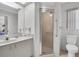Bathroom with single vanity, shower, and toilet at 4635 Bellemede Blvd, New Port Richey, FL 34655