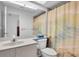 Clean bathroom with shower/tub combo and updated vanity at 4635 Bellemede Blvd, New Port Richey, FL 34655