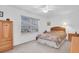 Bright bedroom with carpeted floor, large window, and ceiling fan at 4635 Bellemede Blvd, New Port Richey, FL 34655