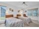 Well lit bedroom with two beds and access to the patio at 4635 Bellemede Blvd, New Port Richey, FL 34655