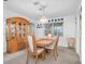 Dining room with wooden table, chairs, and a china cabinet at 4635 Bellemede Blvd, New Port Richey, FL 34655