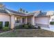 Brick house with a covered porch and well-manicured landscaping at 4635 Bellemede Blvd, New Port Richey, FL 34655