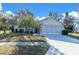 Front view of charming house with attached garage at 4635 Bellemede Blvd, New Port Richey, FL 34655