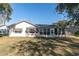 House exterior view, showcasing a large backyard at 4635 Bellemede Blvd, New Port Richey, FL 34655