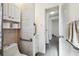 Accessible bathroom with grab bars, toilet and vanity at 4852 Briar Hill Ct, Holiday, FL 34690