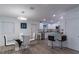 Modern kitchen featuring white cabinets, stainless steel appliances, and glass-top dining table at 5045 Allamanda Dr, New Port Richey, FL 34652