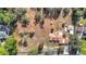 Bird's-eye view of house, outbuildings, and spacious lot at 5085 Bone Ln, Brooksville, FL 34604