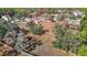 Aerial view showcasing home and surrounding land with trees at 5085 Bone Ln, Brooksville, FL 34604