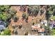 Aerial view of house and expansive lot with mature trees at 5085 Bone Ln, Brooksville, FL 34604