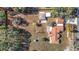 Aerial view showing house and large lot with mature trees at 5085 Bone Ln, Brooksville, FL 34604