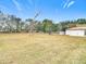 Large backyard with mature trees and open space at 5085 Bone Ln, Brooksville, FL 34604