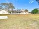 Large backyard with screened patio and shed at 5085 Bone Ln, Brooksville, FL 34604