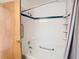Bright bathroom with shower/tub and grab bars at 5085 Bone Ln, Brooksville, FL 34604