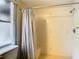 Clean bathroom with shower stall, curtain, and window at 5085 Bone Ln, Brooksville, FL 34604