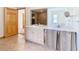 Double vanity bathroom with shower and tile flooring at 5085 Bone Ln, Brooksville, FL 34604