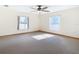 Spacious bedroom with carpeted floor and ceiling fan at 5085 Bone Ln, Brooksville, FL 34604