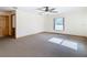Bright bedroom featuring a ceiling fan and carpet at 5085 Bone Ln, Brooksville, FL 34604