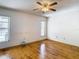Spacious bedroom with hardwood floors and ceiling fan at 5085 Bone Ln, Brooksville, FL 34604