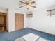 Spacious bedroom with ceiling fan and large closet at 5085 Bone Ln, Brooksville, FL 34604