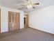 Bright bedroom with ceiling fan and closet at 5085 Bone Ln, Brooksville, FL 34604