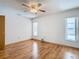 Bedroom with hardwood floors and ceiling fan at 5085 Bone Ln, Brooksville, FL 34604