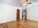 Bedroom with hardwood floors and access to bathroom at 5085 Bone Ln, Brooksville, FL 34604
