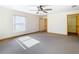 Spacious bedroom with a ceiling fan and window at 5085 Bone Ln, Brooksville, FL 34604