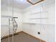 Walk-in closet with wire shelving and a water heater at 5085 Bone Ln, Brooksville, FL 34604