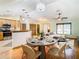Open concept dining area with kitchen and living room views at 5085 Bone Ln, Brooksville, FL 34604