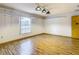 Game room showcasing wood floors and a window at 5085 Bone Ln, Brooksville, FL 34604