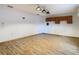 Spacious game room with wood flooring and cabinets at 5085 Bone Ln, Brooksville, FL 34604