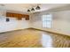Bright game room featuring wood flooring and window at 5085 Bone Ln, Brooksville, FL 34604