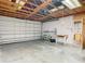Spacious garage with workshop area and shelving at 5085 Bone Ln, Brooksville, FL 34604