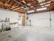 Unfinished garage with exposed beams and workshop area at 5085 Bone Ln, Brooksville, FL 34604