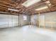 Unfinished garage with a dog pen and storage at 5085 Bone Ln, Brooksville, FL 34604