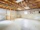 Unfinished garage with storage shelves and window at 5085 Bone Ln, Brooksville, FL 34604